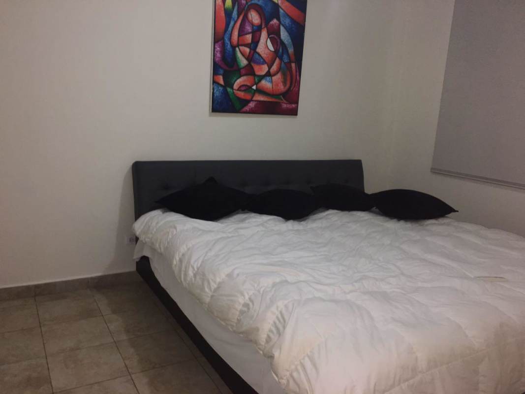 Modern bedroom with tile floor and city views PH La Loma 12 de Octubre Panama