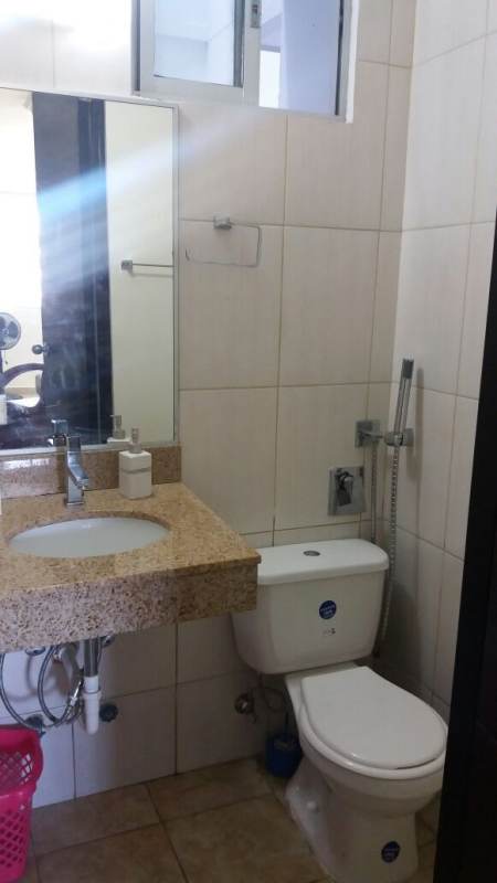 Contemporary bathroom with granite counter, bidet spray and elegant tilework PH La Loma Panama