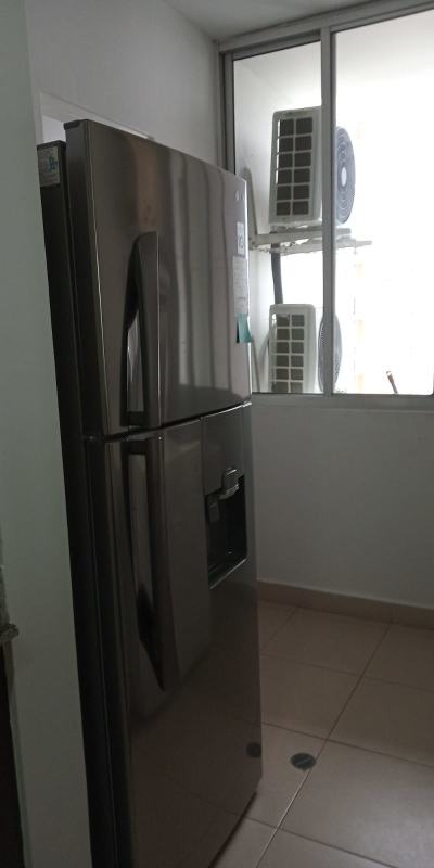 Full view of kitchen with stainless refrigerator and window PH San Francisco Panama City