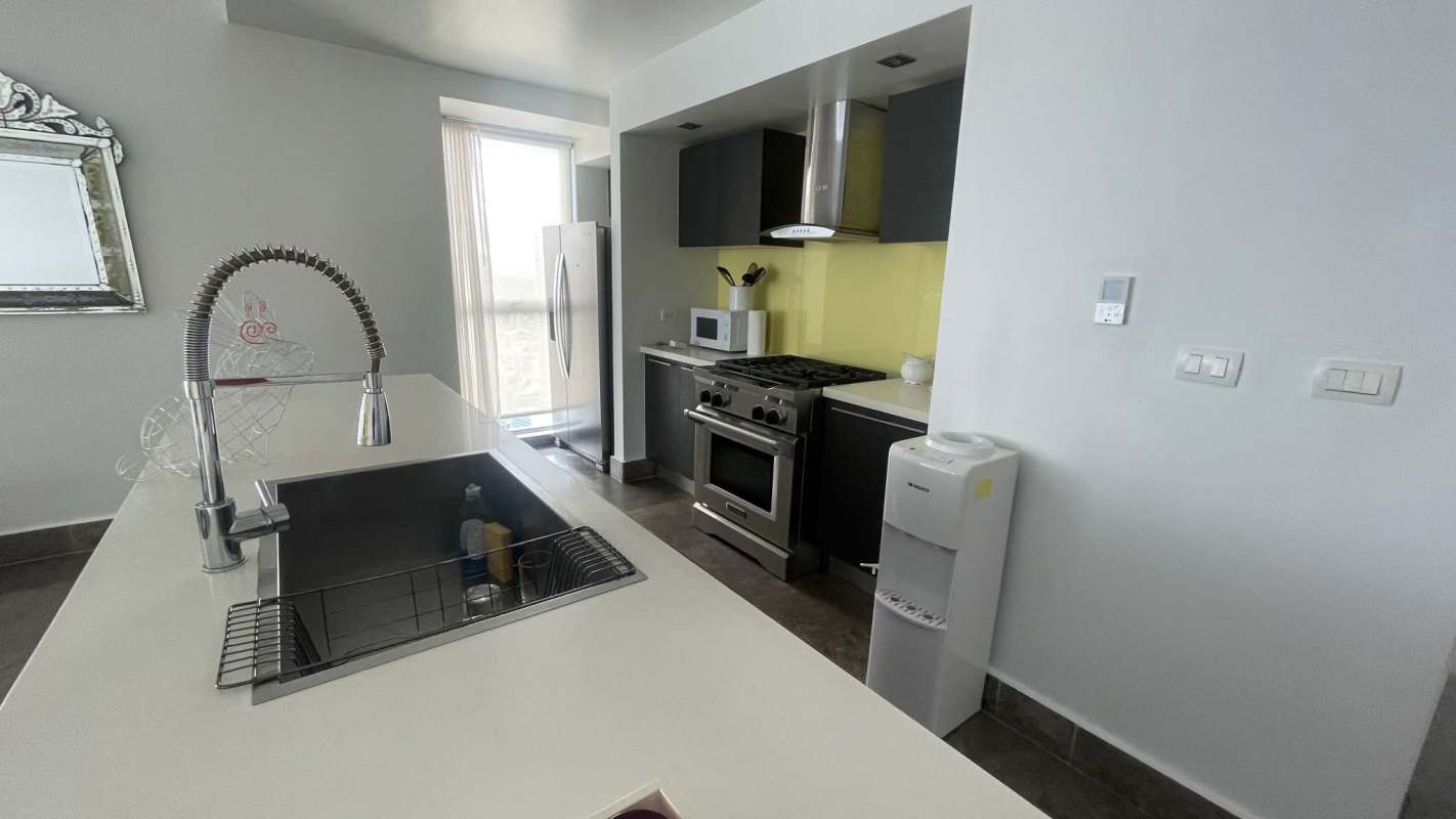 Modern kitchen with marble counters, stainless steel appliances at PH Yoo Panama