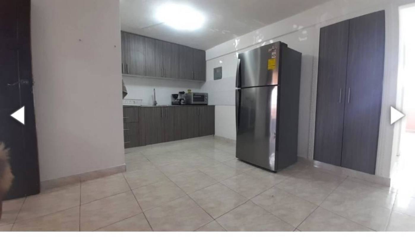 Laundry area with double sink, appliances in PH Vista Hermosa apartment Panama City
