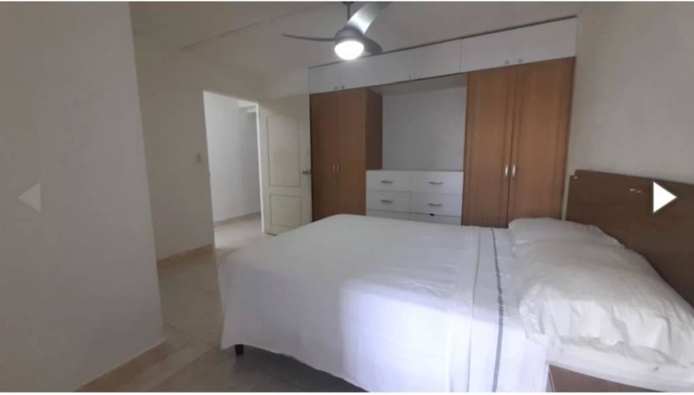 Bedroom with ceiling fan, wardrobe, neutral colors in PH Vista Hermosa apartment Panama City