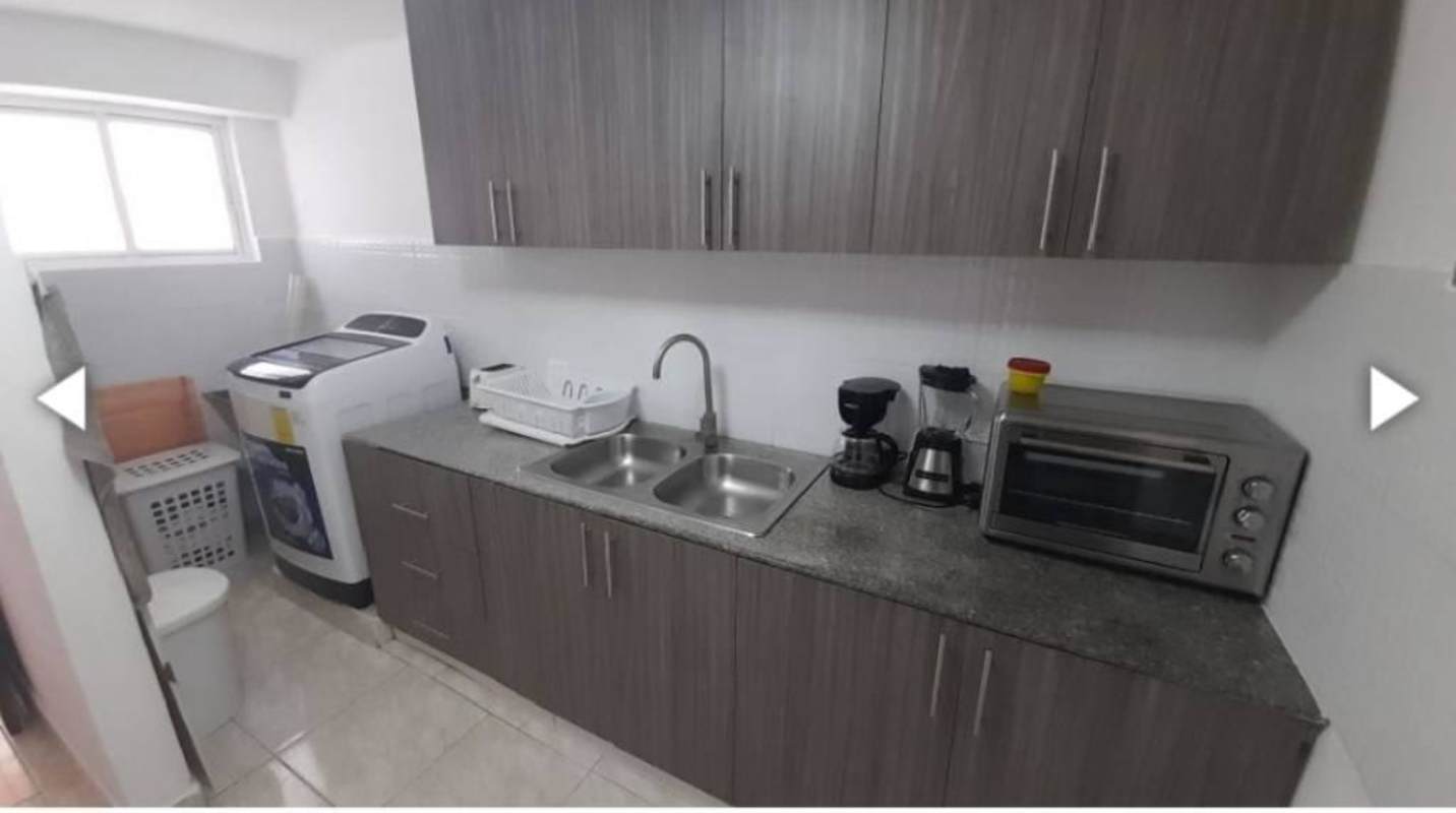 Common area with staircase, metal doors in PH Vista Hermosa apartment Panama City