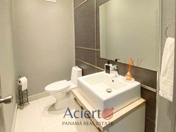 Modern bathroom with quartz vanity, glass shower enclosure luxury condo Quartier Boutique Coco del Mar Panama