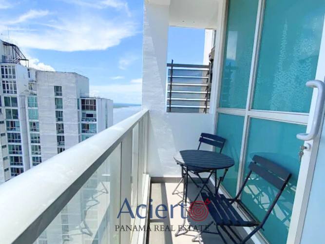 High-rise balcony with glass railing overlooking Panama skyline and ocean Quartier Boutique Coco del Mar