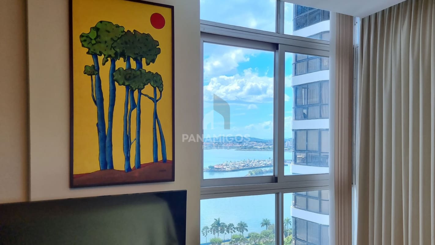Living room with large window city water view modern decor PH Bayfront Panama