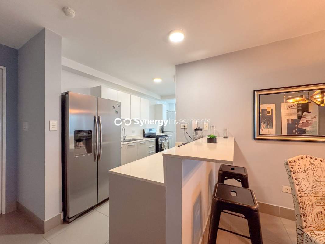 Infinity edge pool with sun deck and lounge chairs in PH Bella Vista Residence Panama City