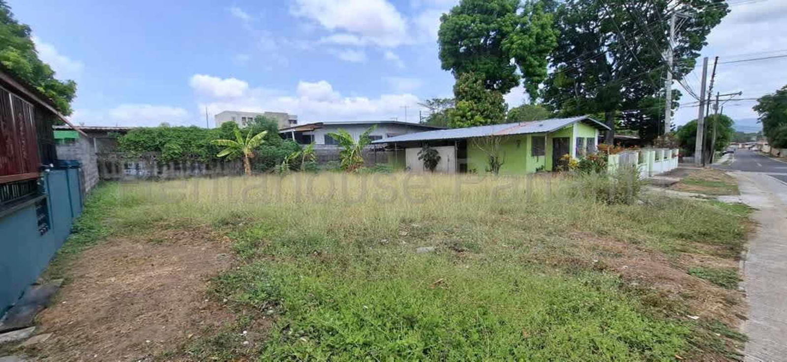 Residential development land near Costa del Este Panama, fenced vacant lot ready to build.