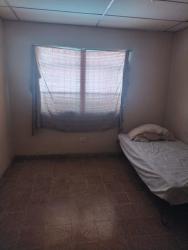Simple bedroom with bars on windows tiled floor Penonomé house