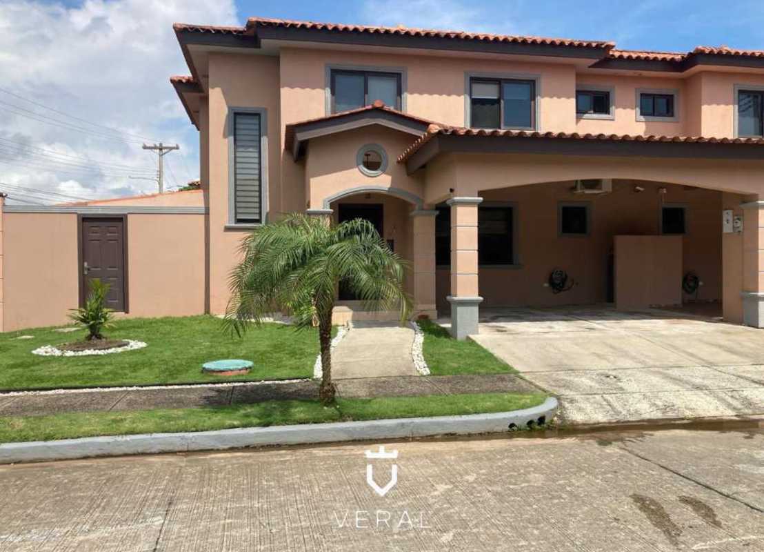 Large living room area with ceramic tile flooring gray sofas striped wallpaper in Versalles I Costa Sur Panama City