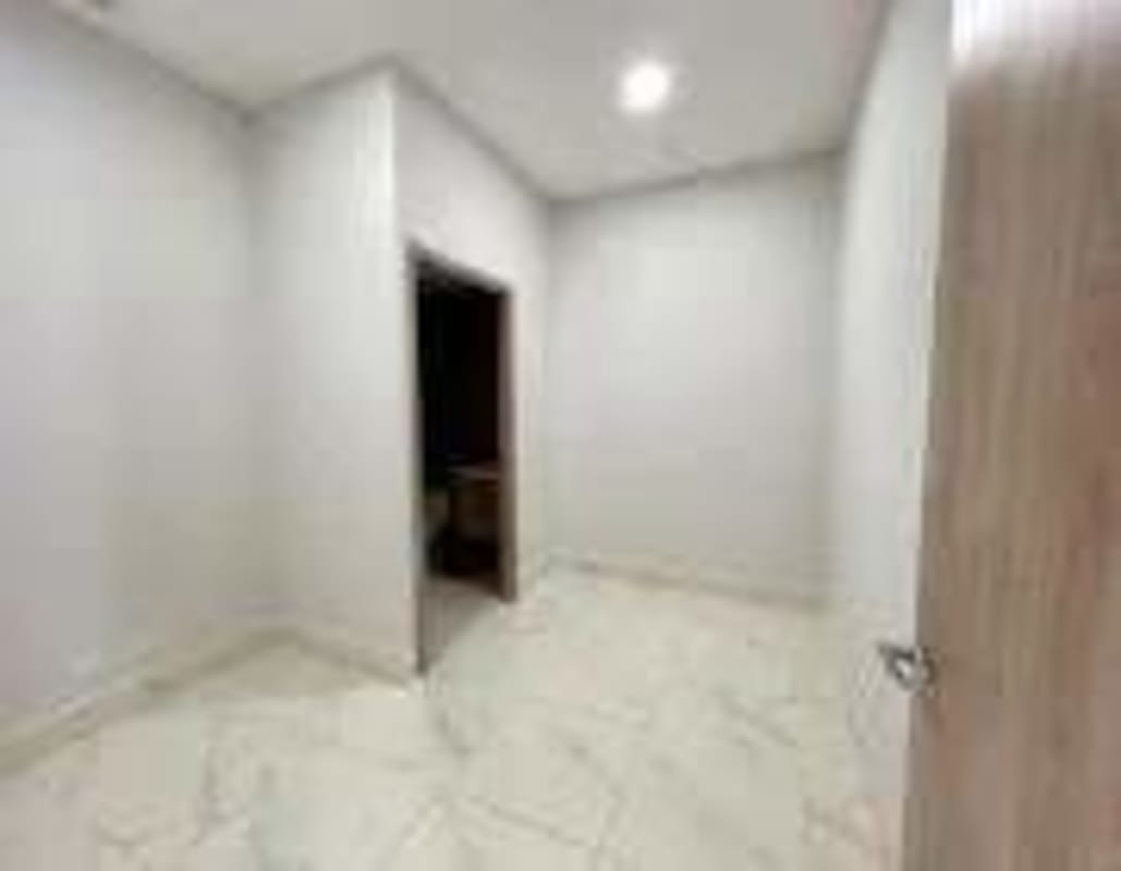 Minimalist empty room with marble tiles inside PH Town Center Panama