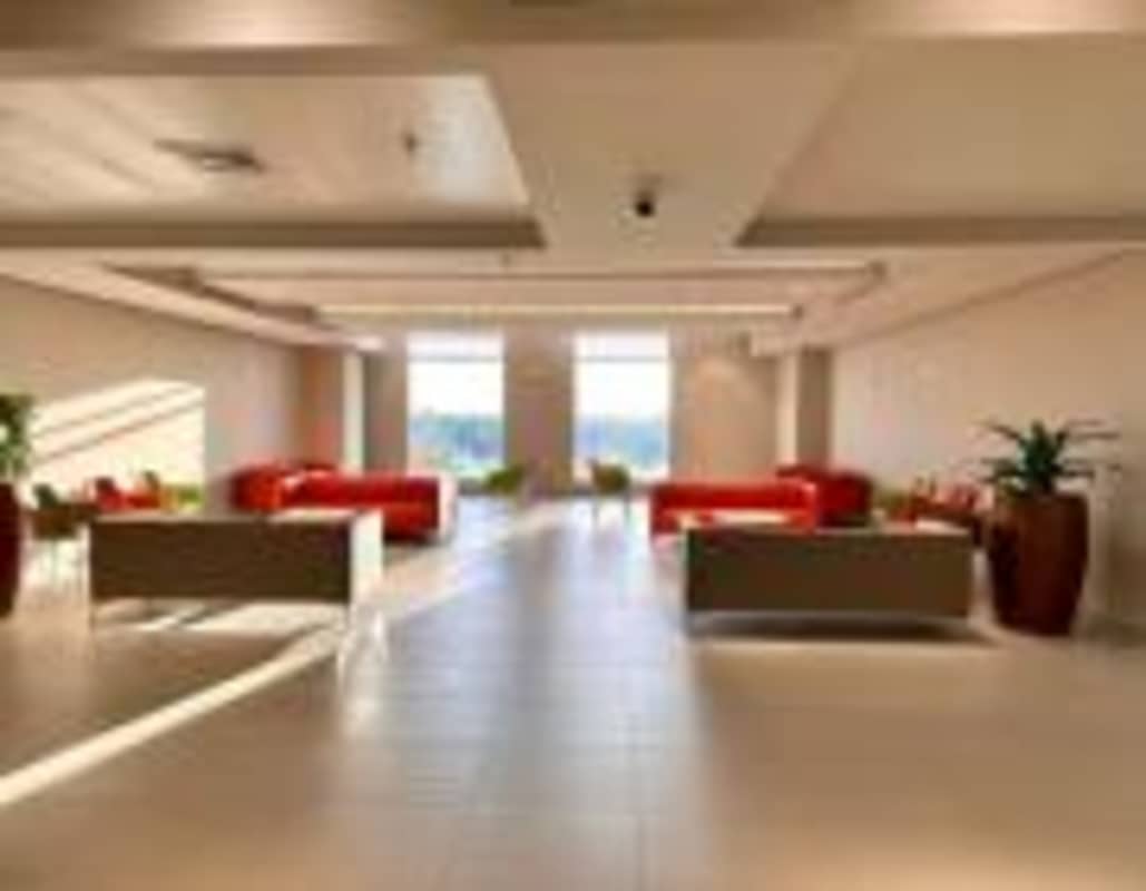 Modern lobby with red sofas tiled floor large windows PH Town Center Panama