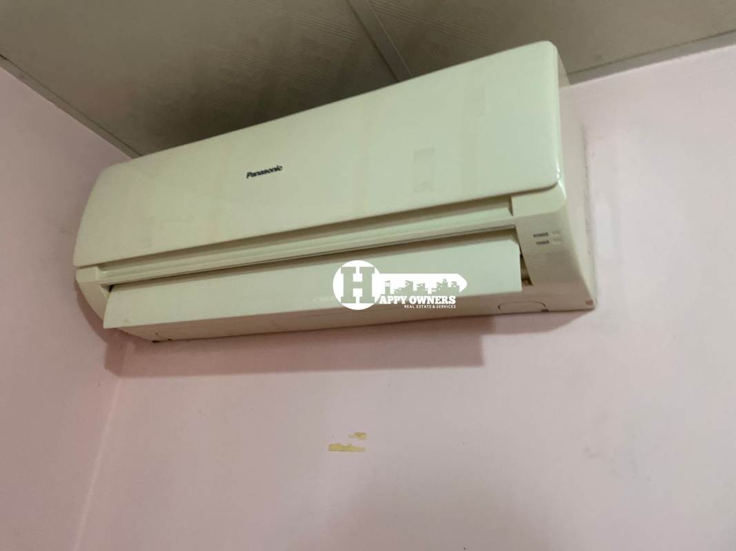 Simple kitchen with tiled walls and sink in Villas de Santa Barbara house Panama