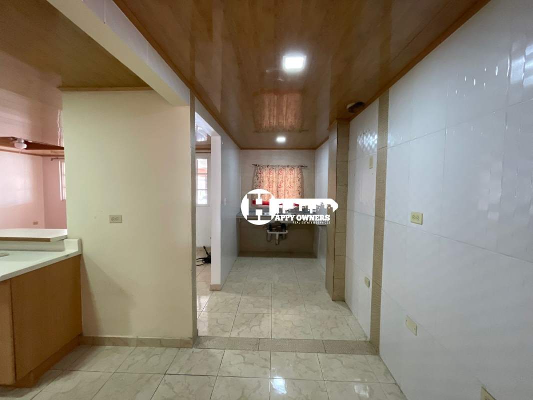 Covered tiled terrace area with security fence front Tocumen Panama City house