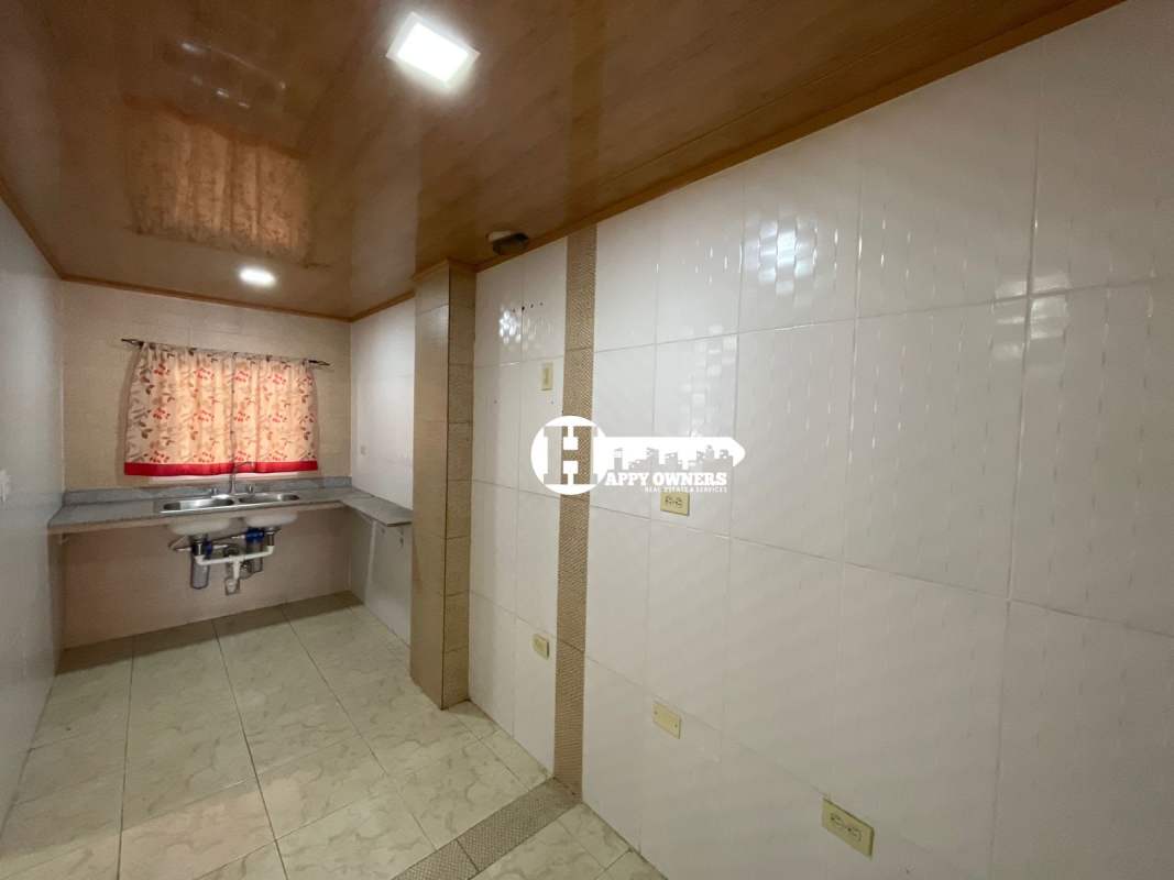 Spacious living and dining room with ceramic tile flooring in family home Tocumen Panama