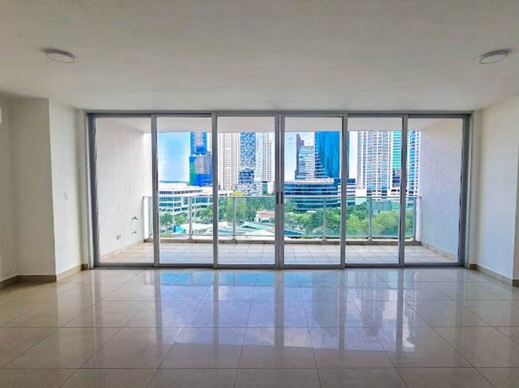 Bright living-dining area with sliding doors to balcony at Costa del Este Tower