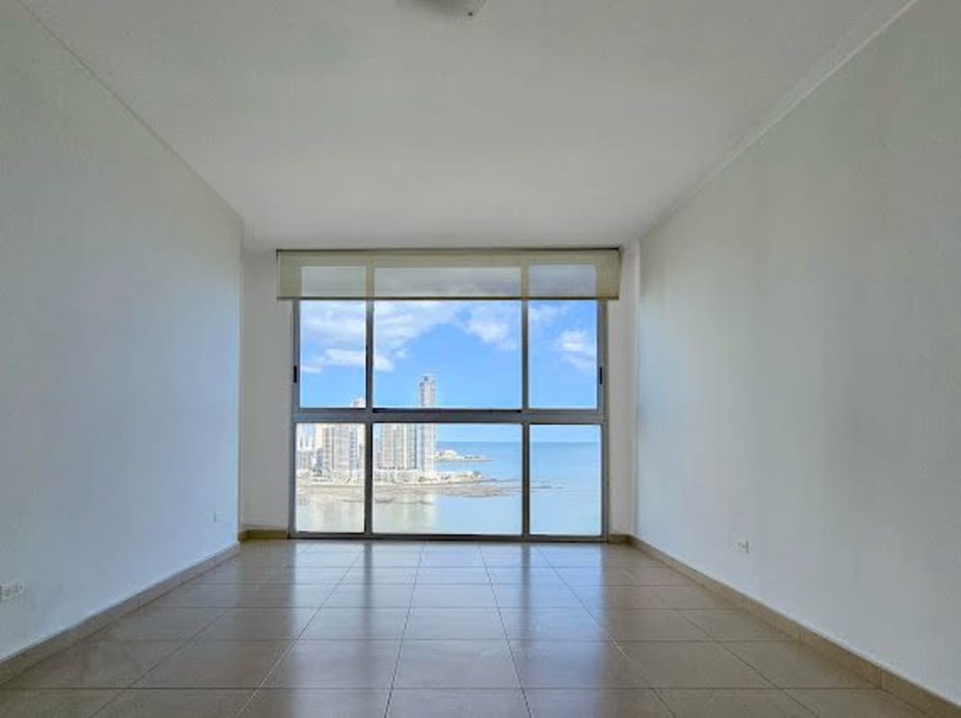 Modern kitchen with appliances and open living space with city ocean views PH BICSA Tower Panama