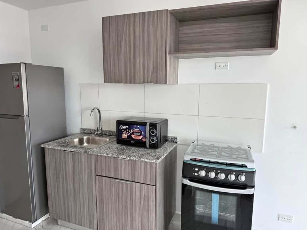 Comfortable bedroom with AC, built-in closet and large window overlooking Panama City at PH El Botánico