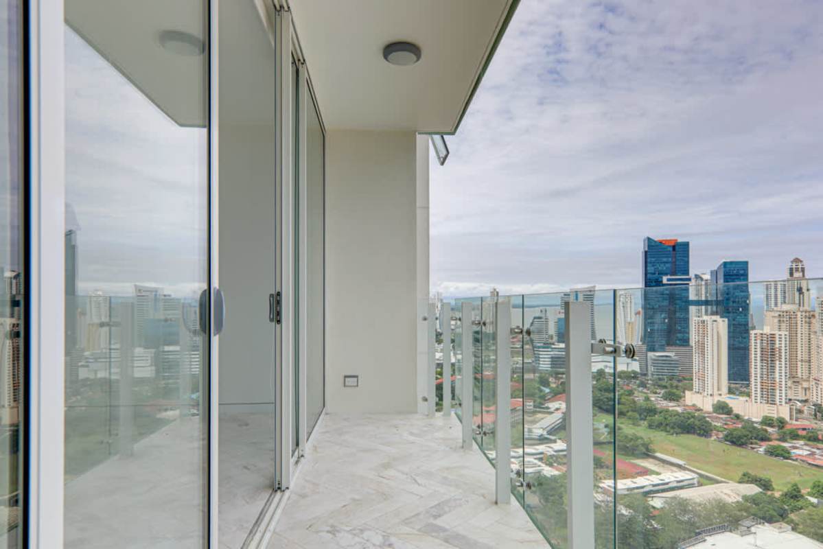 Spacious bedroom marble floors and panoramic skyline ocean views Wanders & Yoo Panama