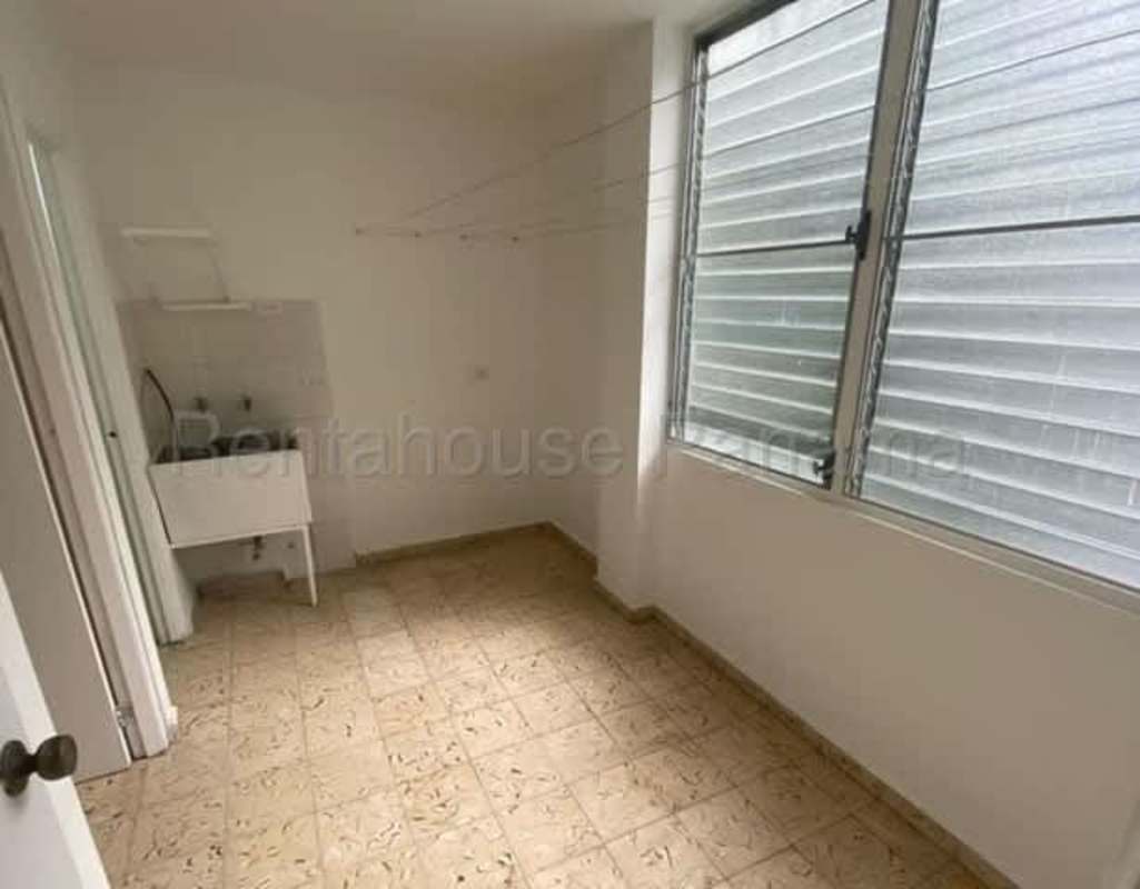 Laundry room with double sink bright natural light Parque Lefevre apartment Panama