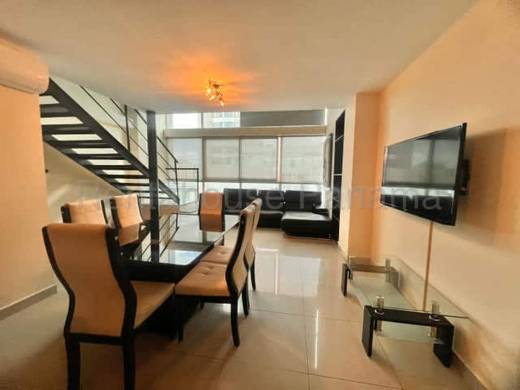 Open kitchen with granite countertops, appliances, dark cabinetry PH Park Loft El Cangrejo Panama