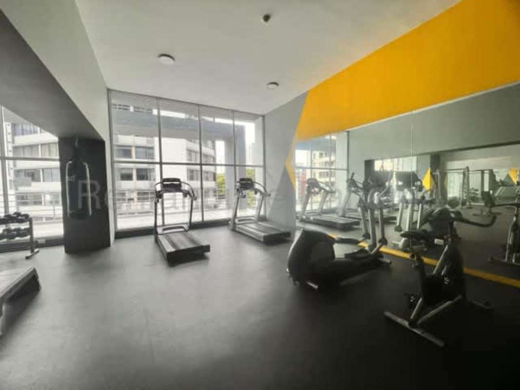 Condo resident gym with cardio machines, mirrored walls PH Park Loft Panama City