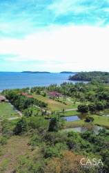 Tropical coastal view with lush greenery and ocean waves at Rincon Beach Estates