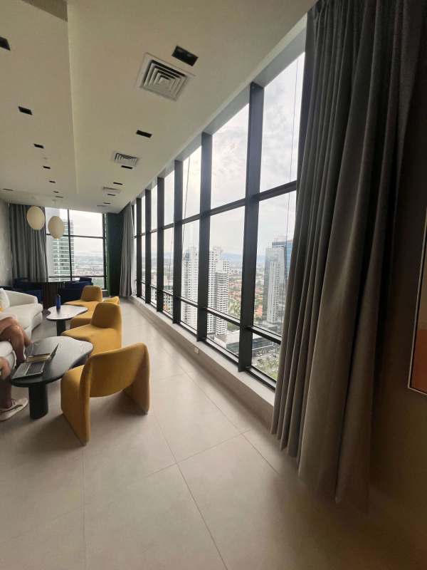 Double-height elegant lobby with modern lounge at PH Arcadia Costa del Este Panama