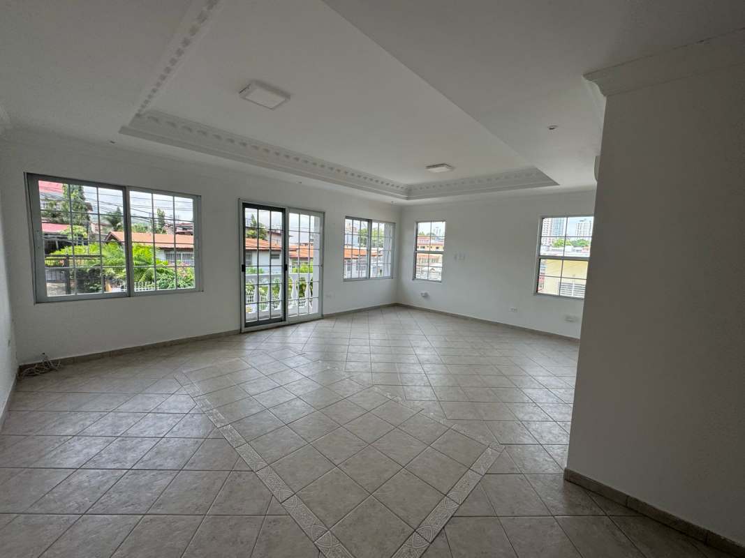 Spacious tiled living room with natural light and large windows Betania Panama