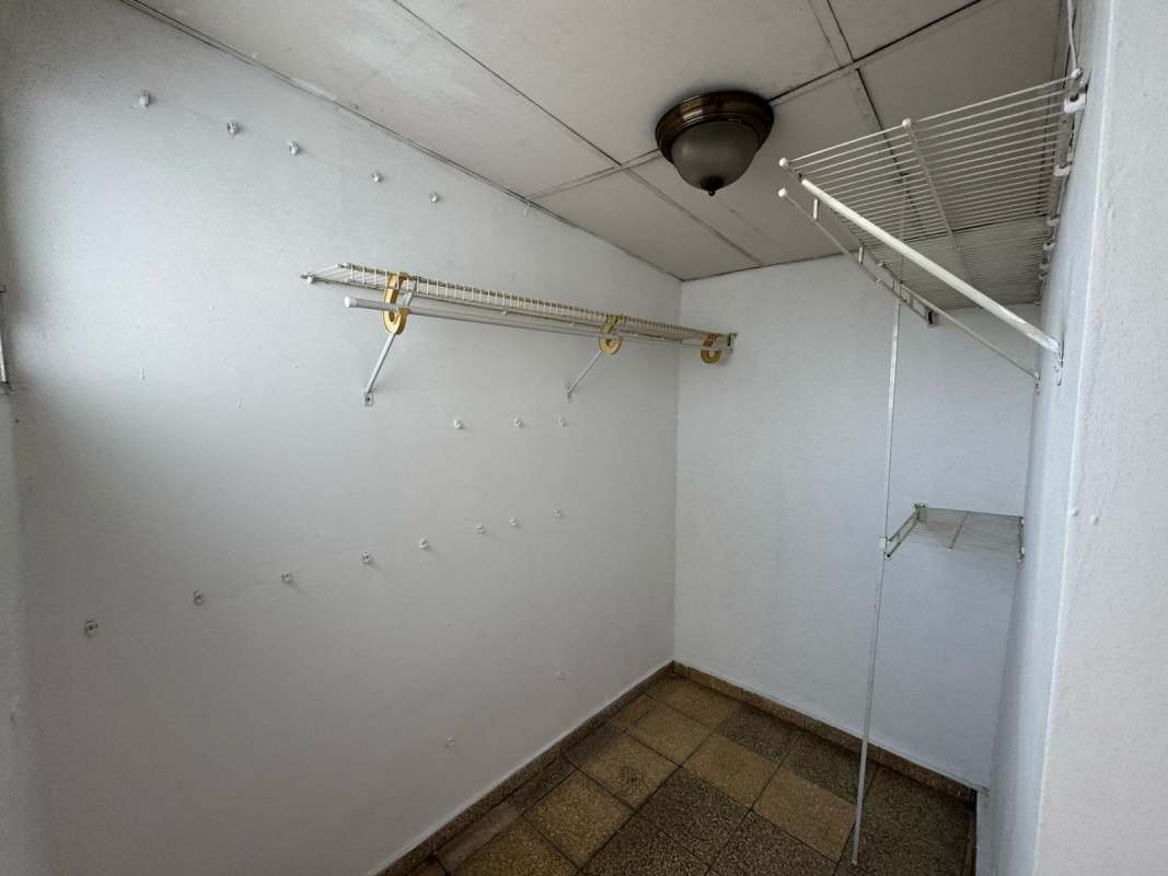 Kitchen with granite countertops and wooden cabinetry in Betania Panama