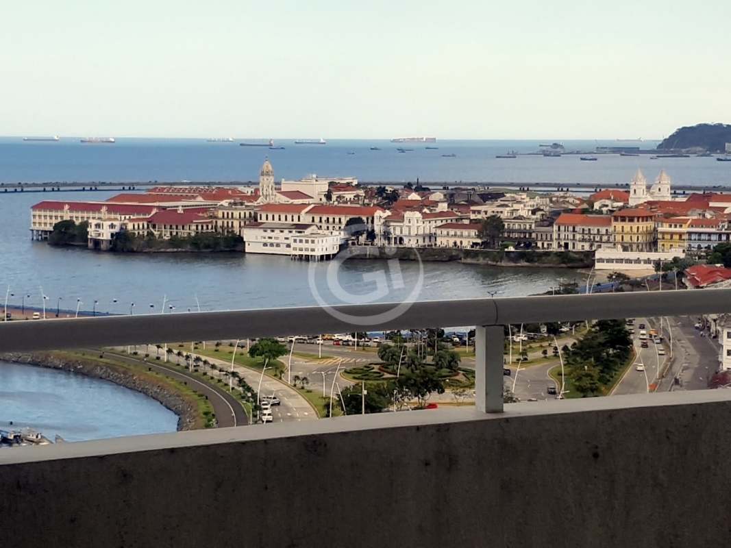 Modern kitchen with granite counters, ample cabinetry and large window overlooking city skyline in Bay View Panama