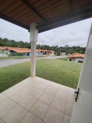 Covered veranda overlooking yard in corner property Brisas del Golf Arraiján Panama