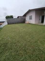 Large fenced grass yard around corner house in Brisas del Golf Arraiján Panama for sale