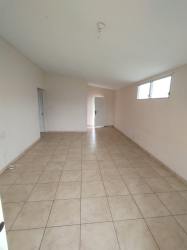 Single story pink house corner lot with green lawn for sale Brisas del Golf Arraiján Panama