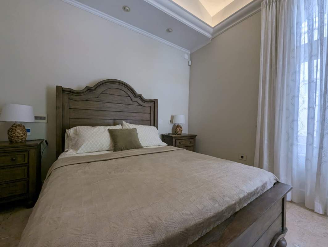 Bedroom with split AC, built-in wardrobe and garden views in apartment at Albrook Residences Panama City