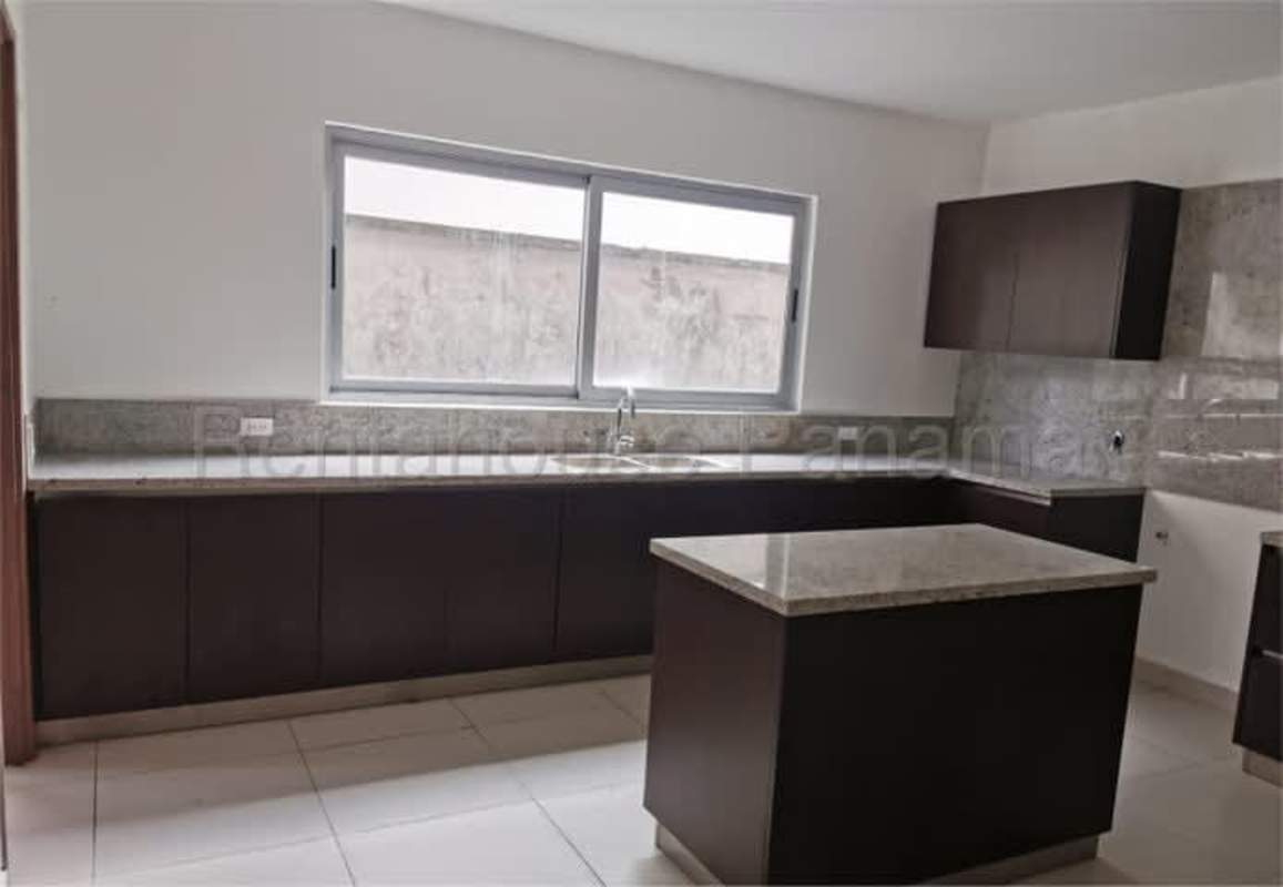 Modern kitchen island and granite countertops in Altos del Parque Condado del Rey Panama City