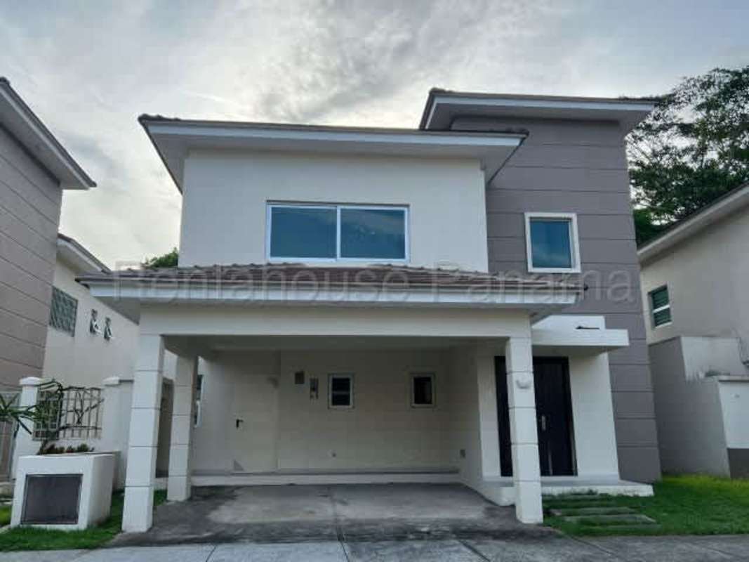 Contemporary two-story house exterior with carport in Altos del Parque Panama