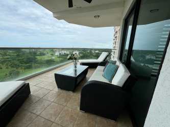Elegant kitchen with granite counters, dark cabinetry, stainless appliances, ocean views in Vistamar Resort San Carlos Panama