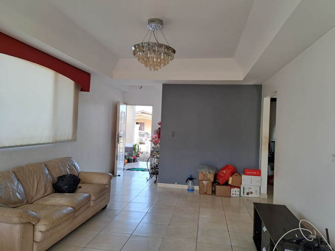 Bedroom with built-in closet, window, AC unit, tiled floor in PH Vista del Valle Villa Lucre Panama