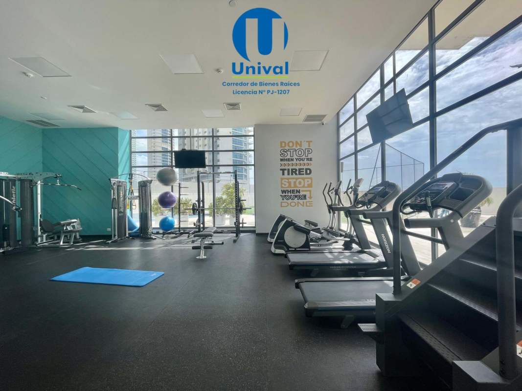 Contemporary gym with cardio machines and weights in PH Paramount Costa del Este Panama