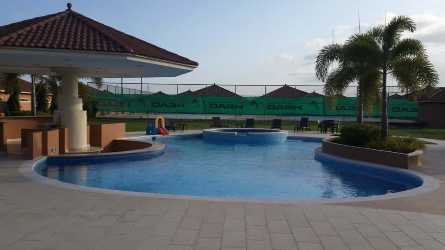 Modern living area with high ceilings, large windows at Sunset Coast Costa Sur