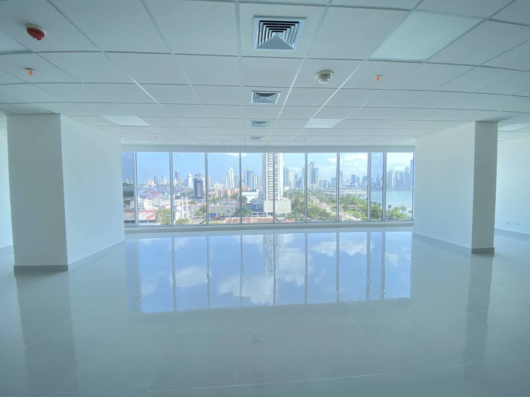 Grey shell modern office with floor-to-ceiling windows overlooking Panama Bay in PH BICSA