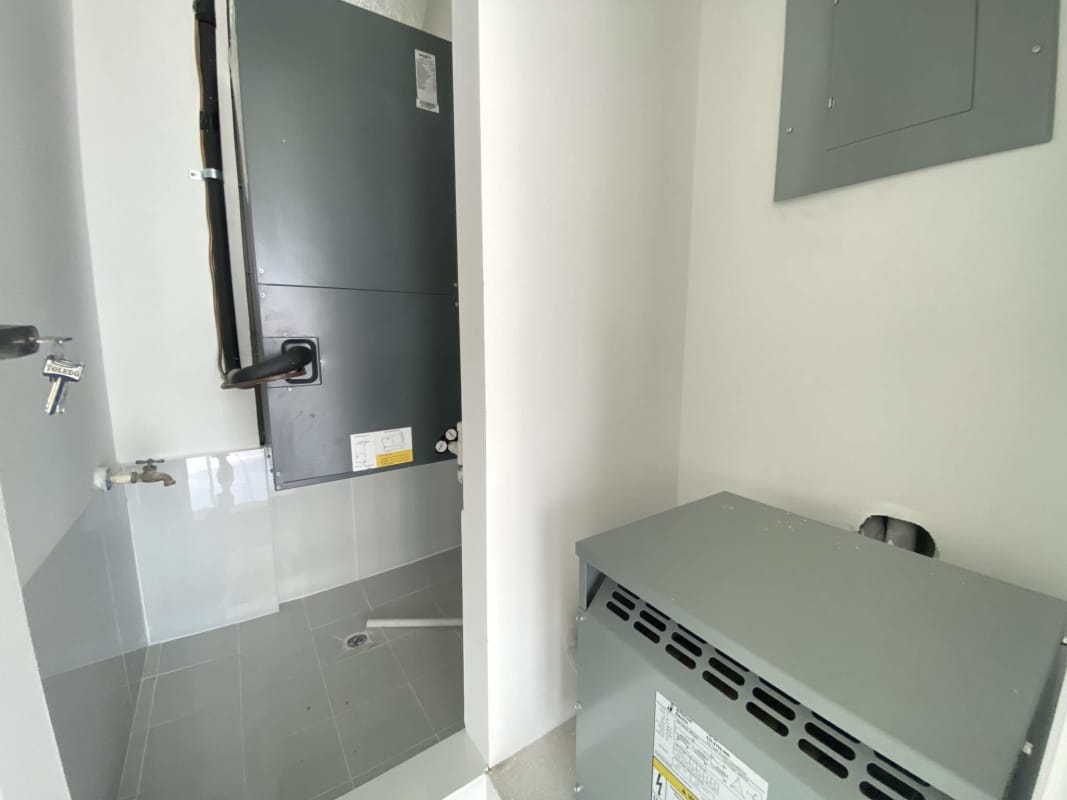 Minimalist bathroom in unfinished commercial office PH BICSA with toilet sink mirror