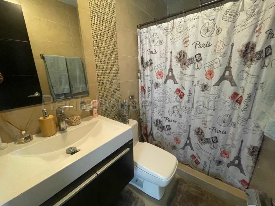 Contemporary bathroom with glass shower and designer vanity at The One Tower San Francisco Panama