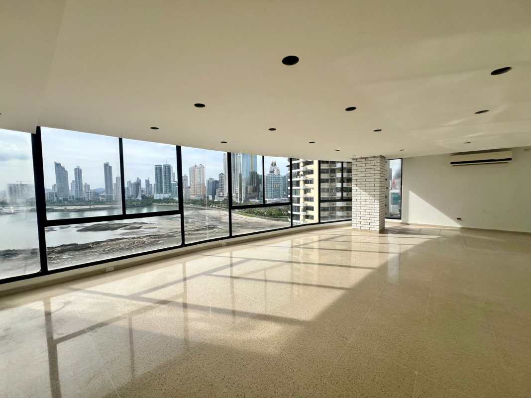 Bright dining and living space with floor-to-ceiling windows and views at PH Mar de Plata Punta Paitilla Panama
