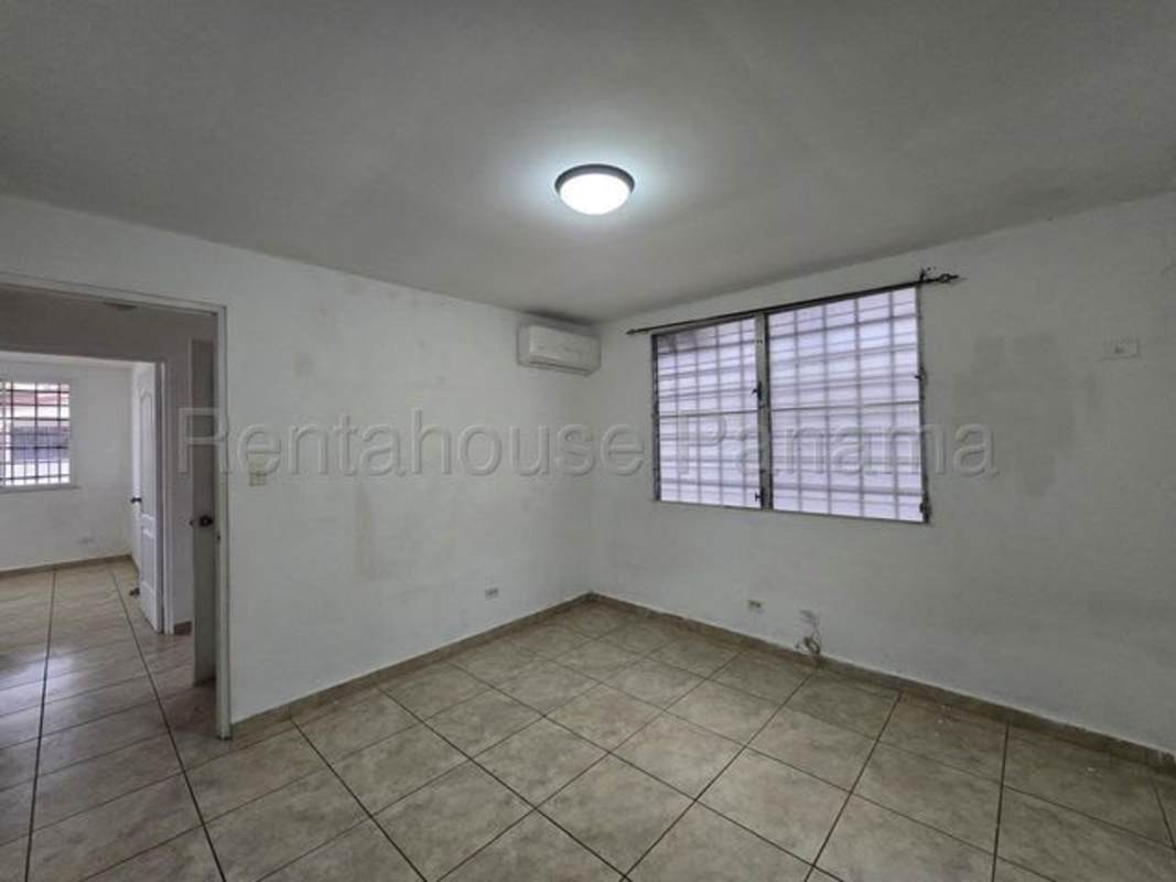 Kitchen with granite countertops tiled walls and dark wood cabinets house for rent Panama