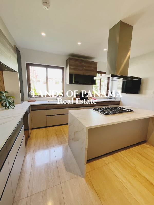 Bright open-plan living and dining room marble floors The Woods Santa Maria Panama