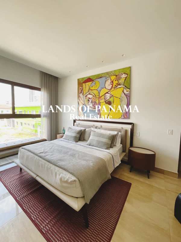 Spacious bedroom with large window city view in luxury home The Woods Santa Maria Panama