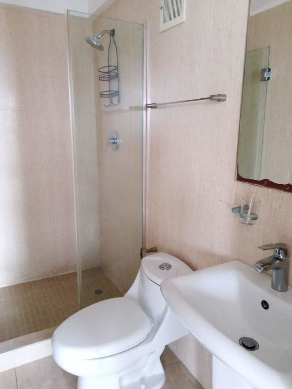 Bright living room opening to balcony PH Condado Gardens Condado del Rey Panama City