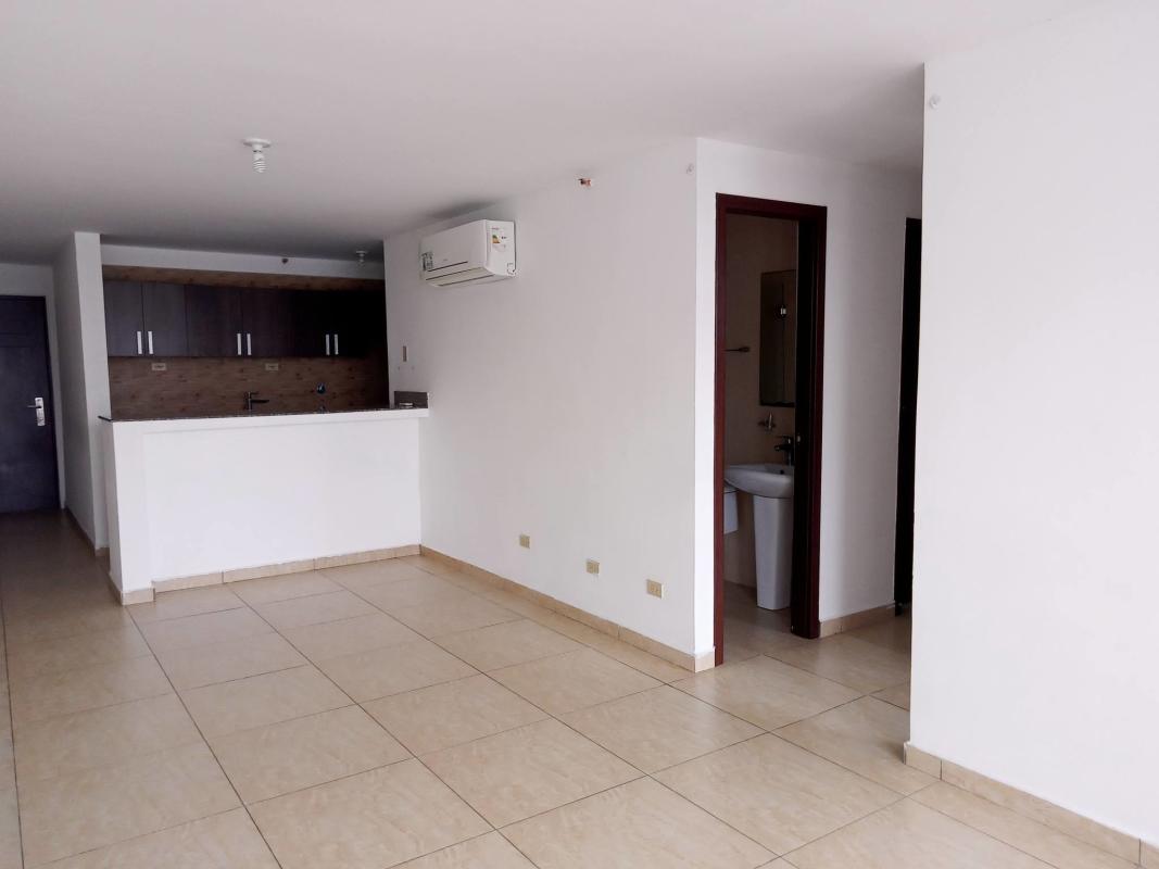 Modern kitchen with granite countertops, dark wood cabinets in PH Condado Gardens Condado del Rey Panama